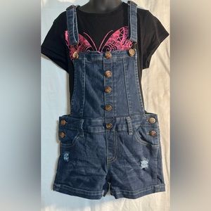 Girl’s blue jean overalls.